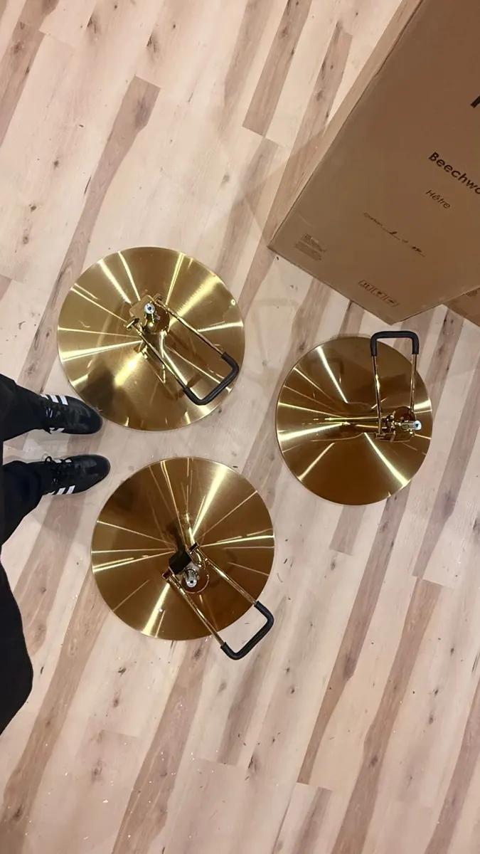 Gold domed hood dryers on the salon floor