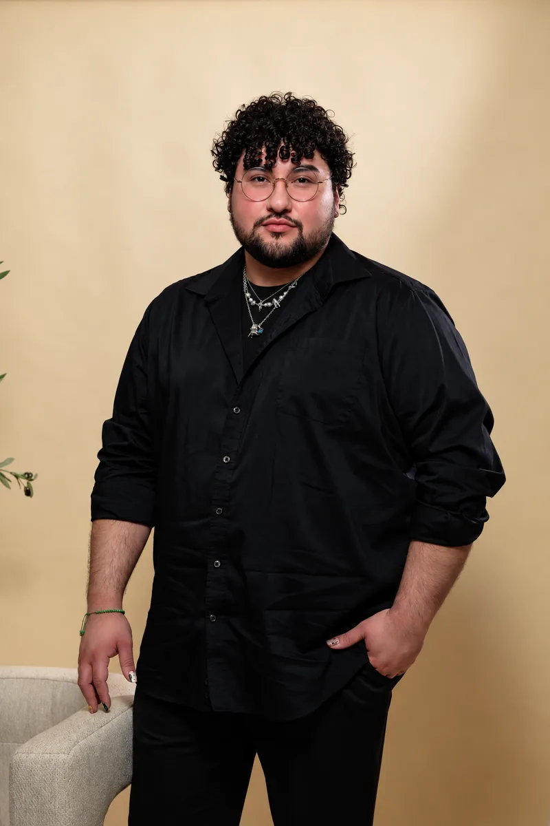 Josh Villarreal, Platinum stylist, in a black button-up shirt